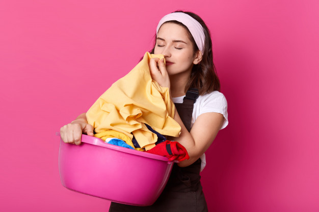 https://laundrytogo.co.uk/storage/posts/photo-young-attractive-woman-working-home-wears-t-shirt-brown-apron-hair-band-standing-with-pink-basin-with-clean-linen-isolated-rose-wall-photo-studio-smells-fresh-clothes-176532-6461.jpg